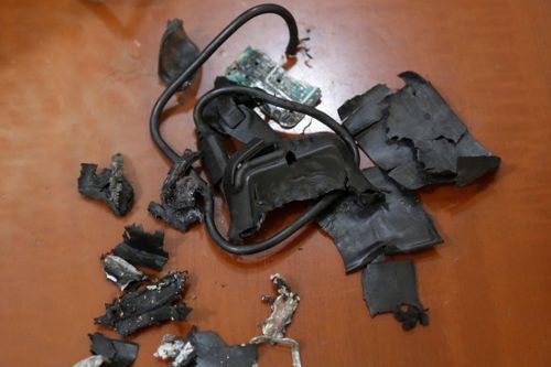 Charred remains of an exploded pager device rigged with PETN