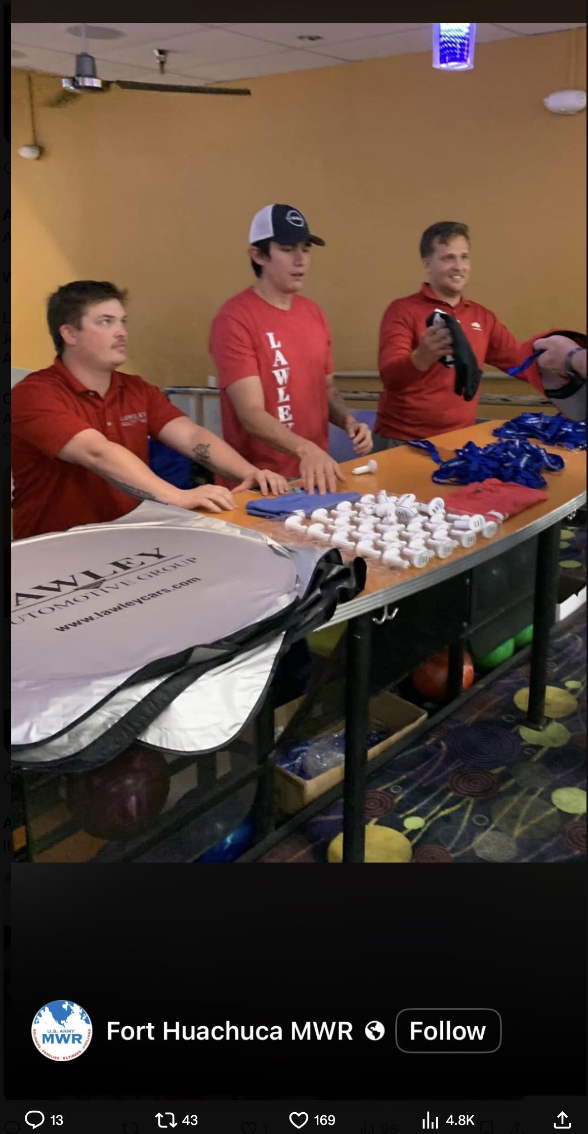Three young men in Lawley Automotive Group shirts at a Fort Huachuca MWR event, from a Fort Huachuca MWR social-media post.