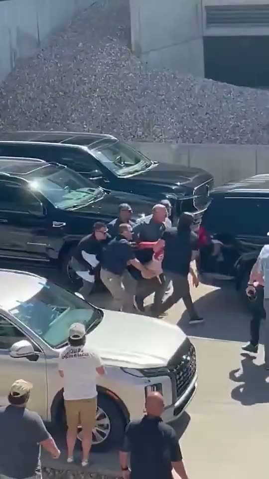 Eight Seconds: A Protective Detail Loads a Vehicle